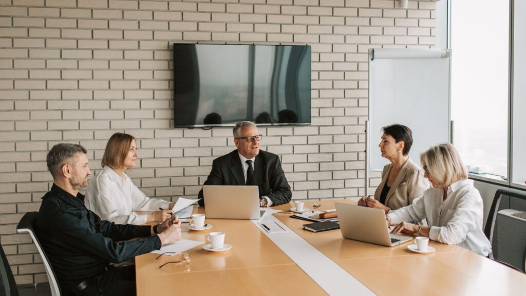Business team discussing workspace and growth plans.
